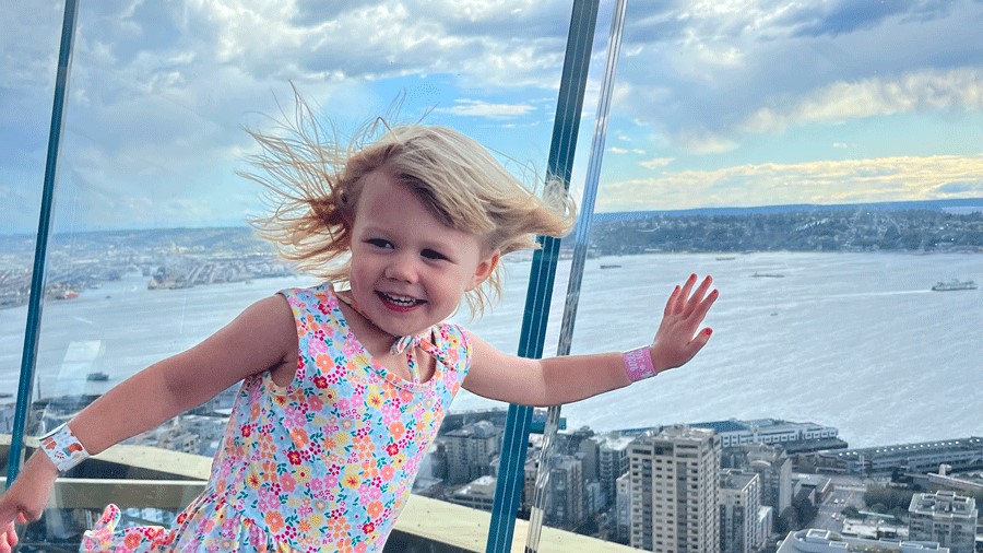 "Toddler pressing the glass at the Space Needle, a Seattle thing to do with toddlers"