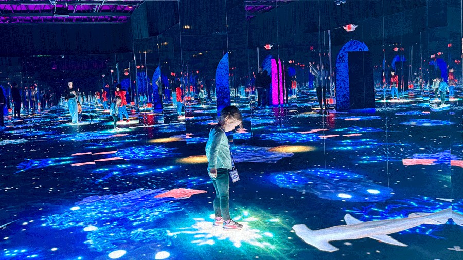 young girl in the LED room of bubble planet