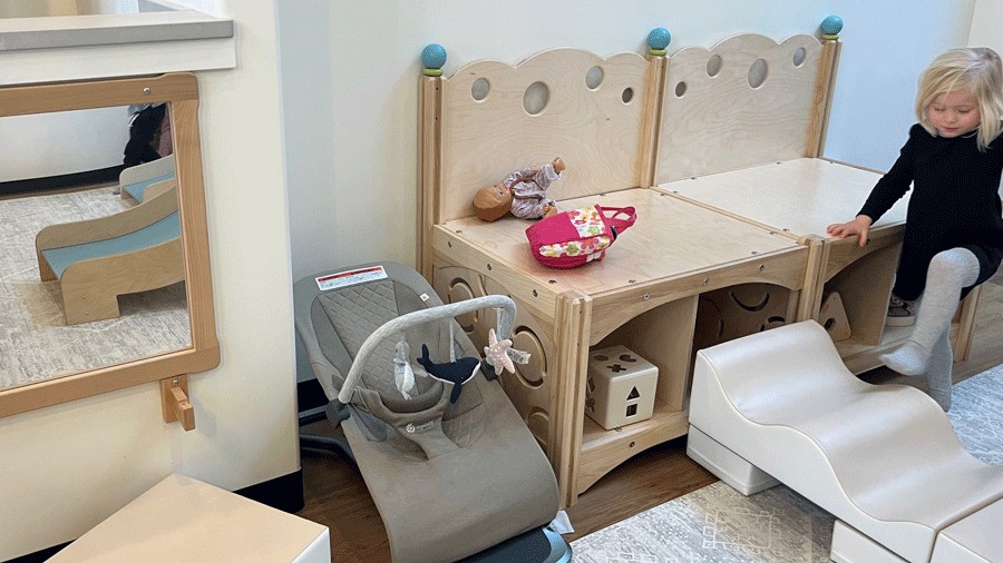 bouncer and play area for toddlers and infants at Holiday Cafe, a kid-friendly coffee shop