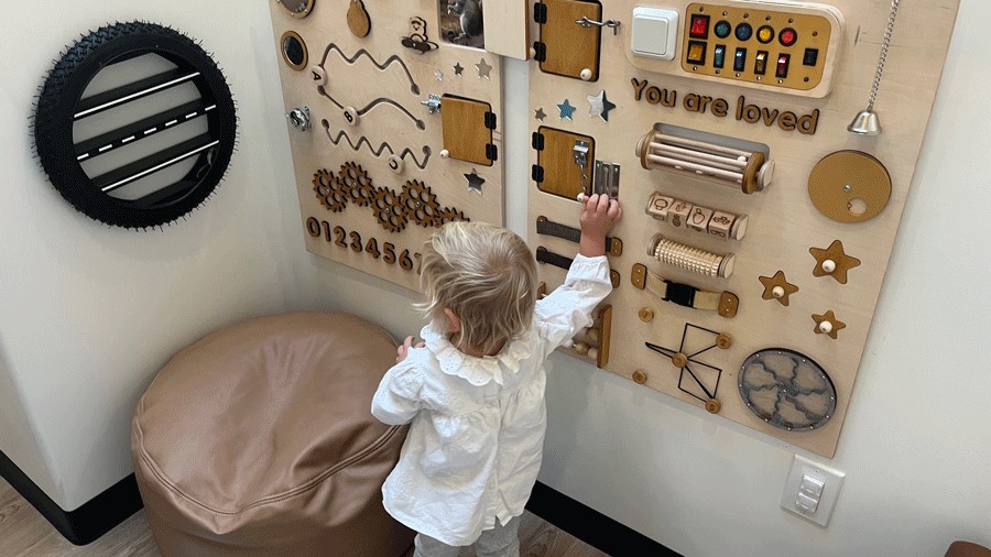 toddler busy board at Holiday Cafe indoor play space