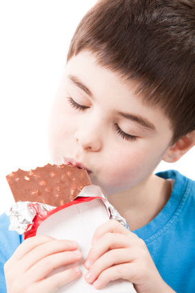 Boy with candy bar