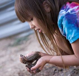 Kid with Rocks