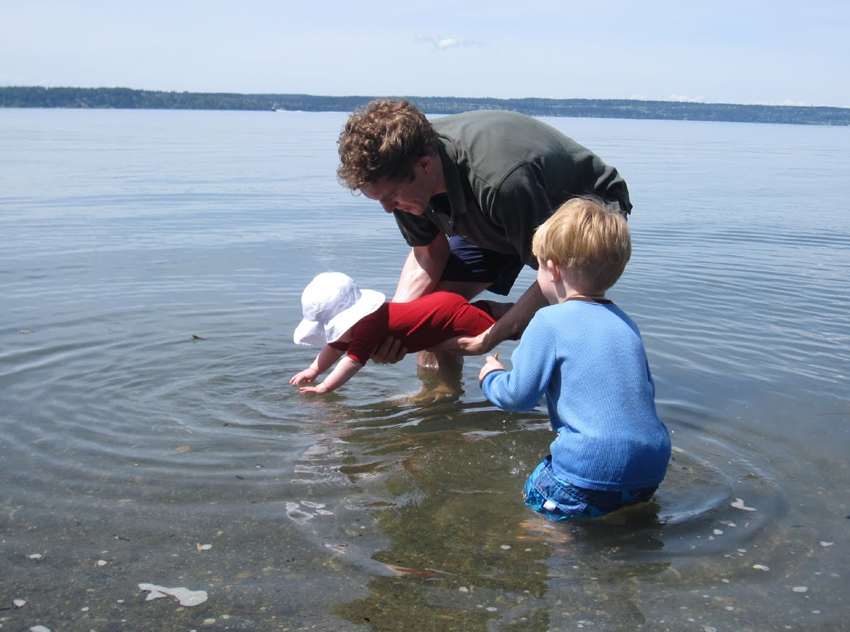 Family playing in water