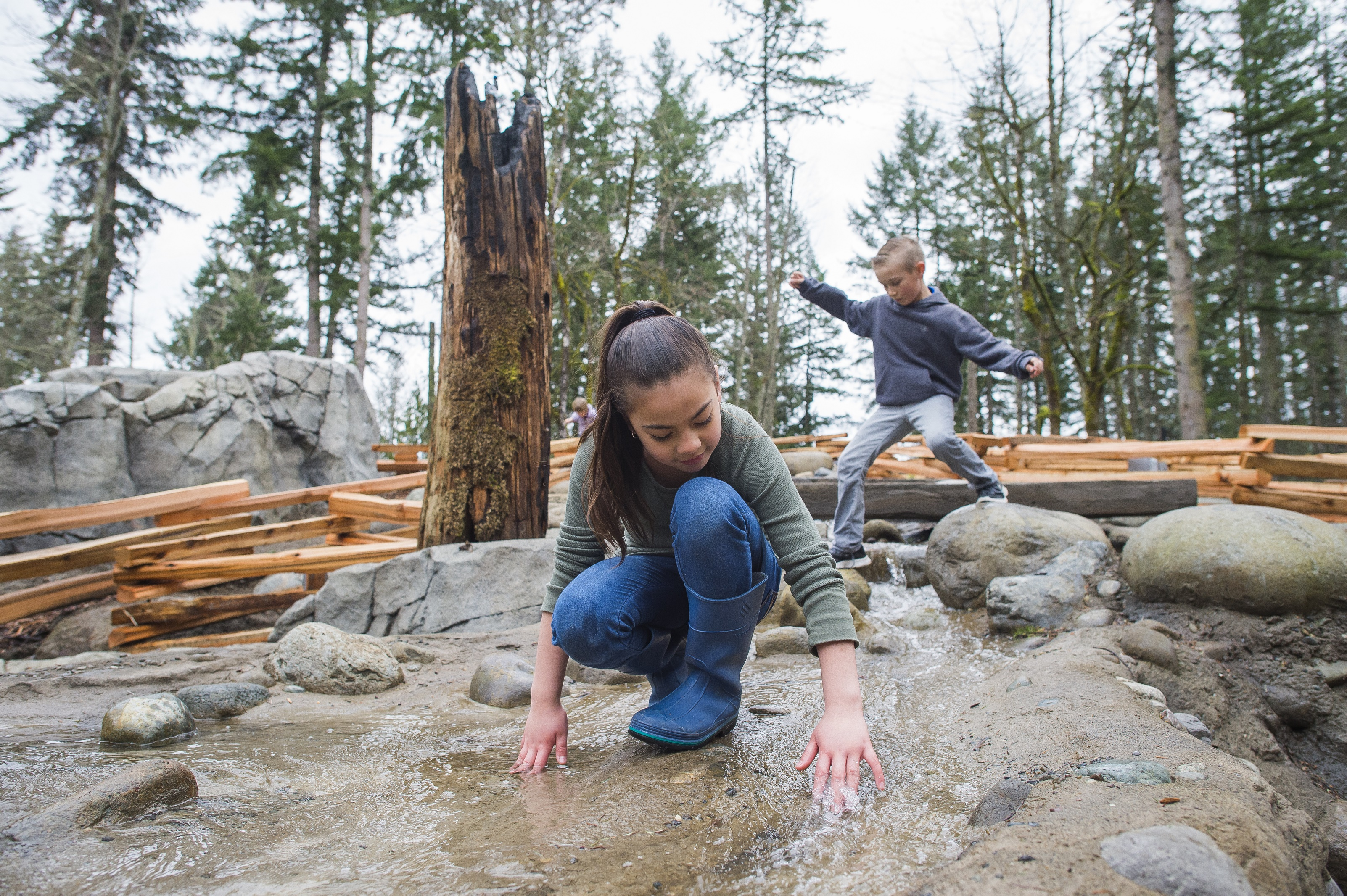 Kids playing in stream at Kids' Trek