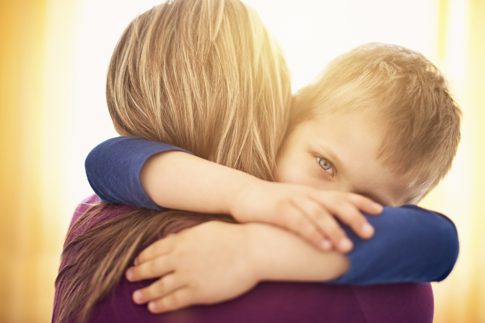 mother and son hugging