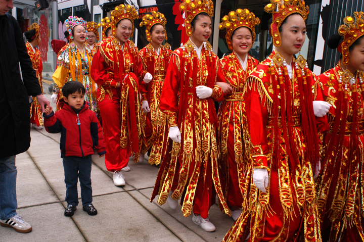 Dancers getting off the streetcar on Jackson Street. 