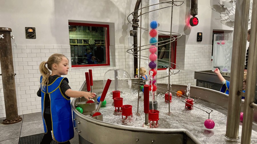 "Young girl at Imagine Children’s Museum in Everett plays with water at the Water Works exhibit"