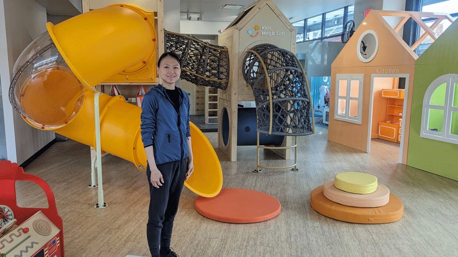 Kids Magic Lab owner Yalin Zhu-Hu standing in front of her new indoor playground near Seattle.