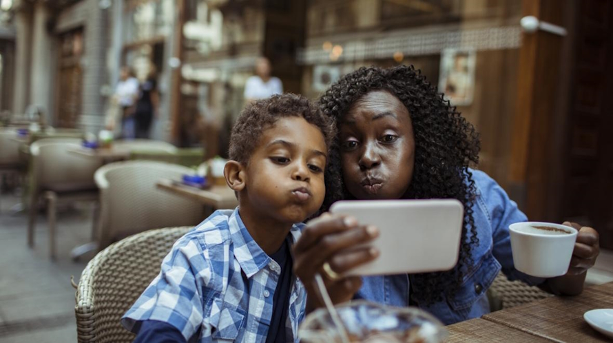 "Mom and son at a cafe one on one time"