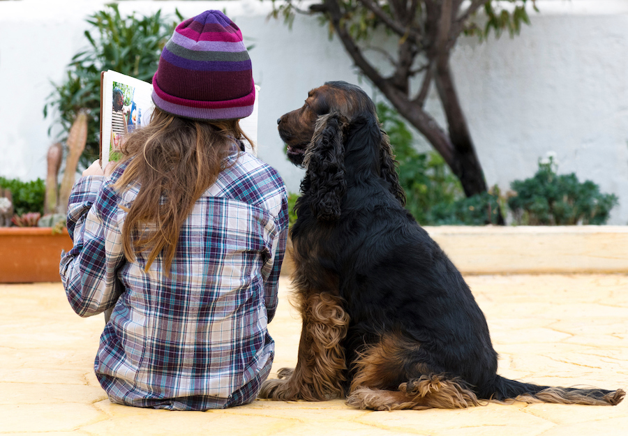 child reading with a dog