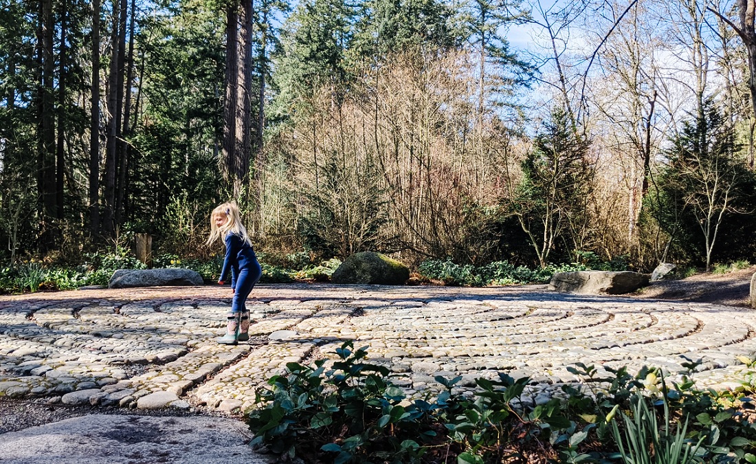 Pausing at a labyrinth stop on Bainbridge Island during exploration scavenger hunt activity kit