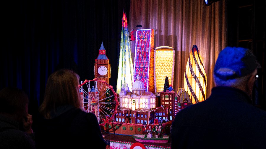 visitors admiring the Gingerbread Village in Seattle on Christmas Day