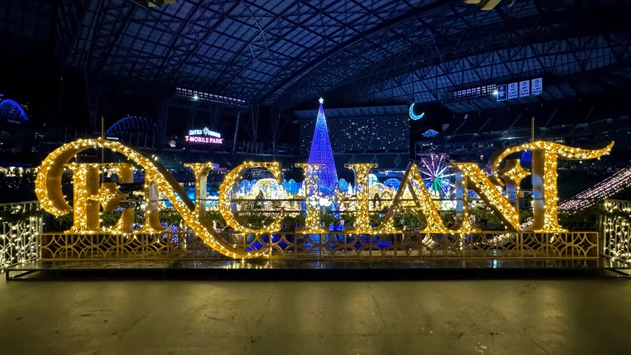 Lit letters spelling Enchant at the Christmas light maze in Seattle, a popular holiday attraction