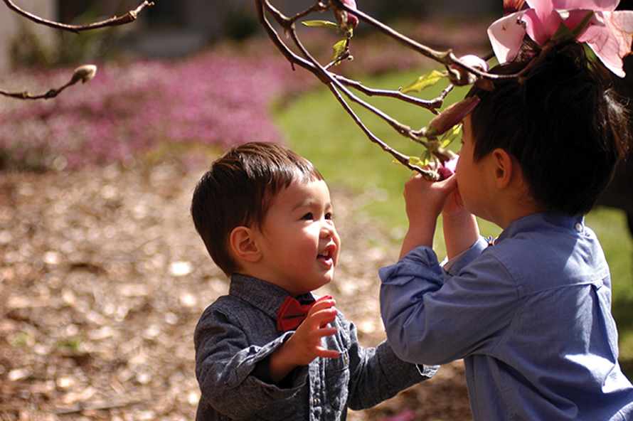 kids with magnolia blossoms