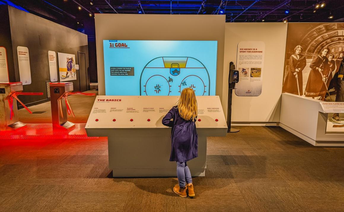 Learning the rules at the beginning of Hockey: Faster Than Ever interactive hockey exhibit at Seattle's Pacific Science Center