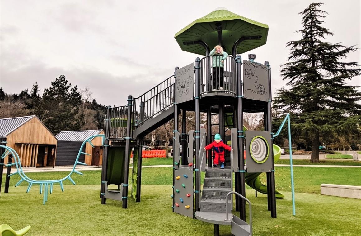 Kids playing on climbing structure at Kirkland's new Juanita Beach Park playground