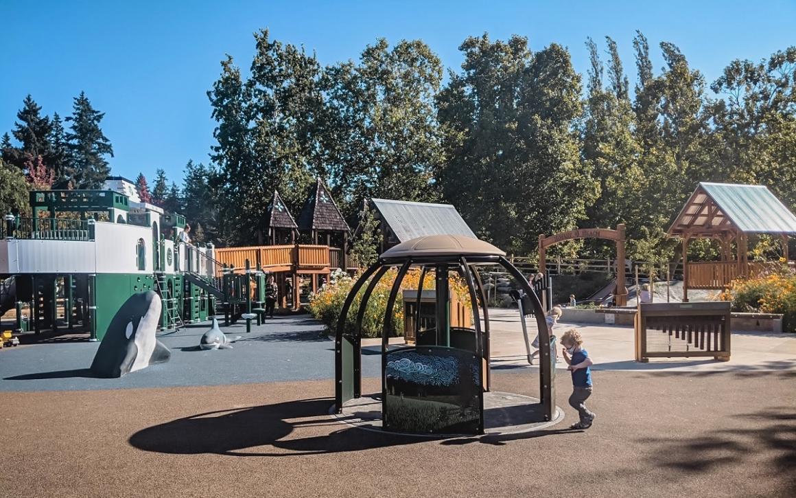 We-Go-Round surface level accessible merry-go-round at new ferry boat playground on Bainbridge Island near Seattle kids and families