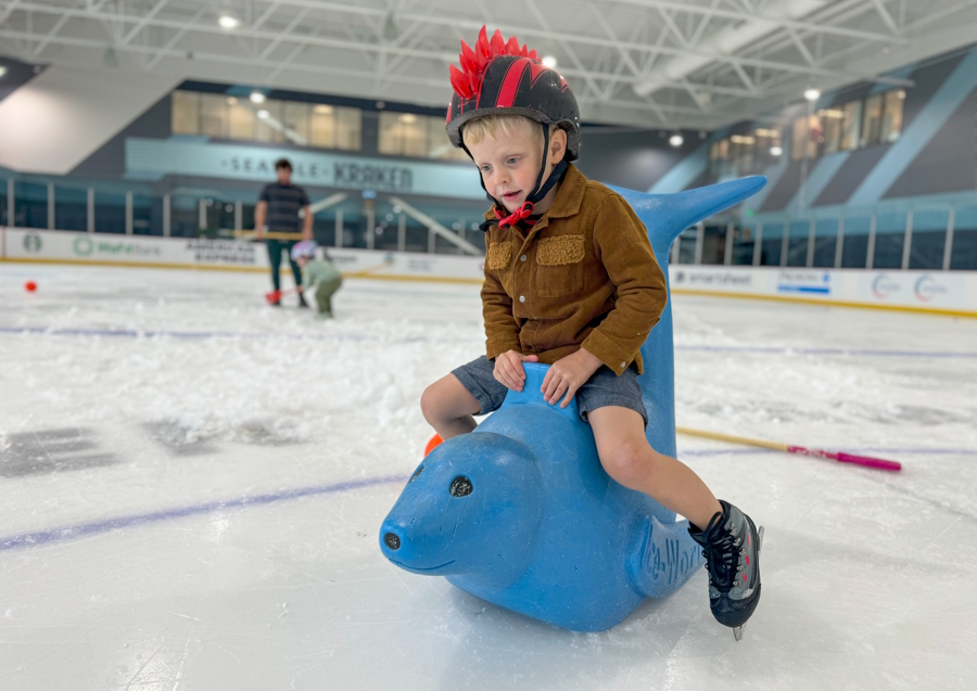 Young boy on a seal push toy at Kraken Community Iceplex