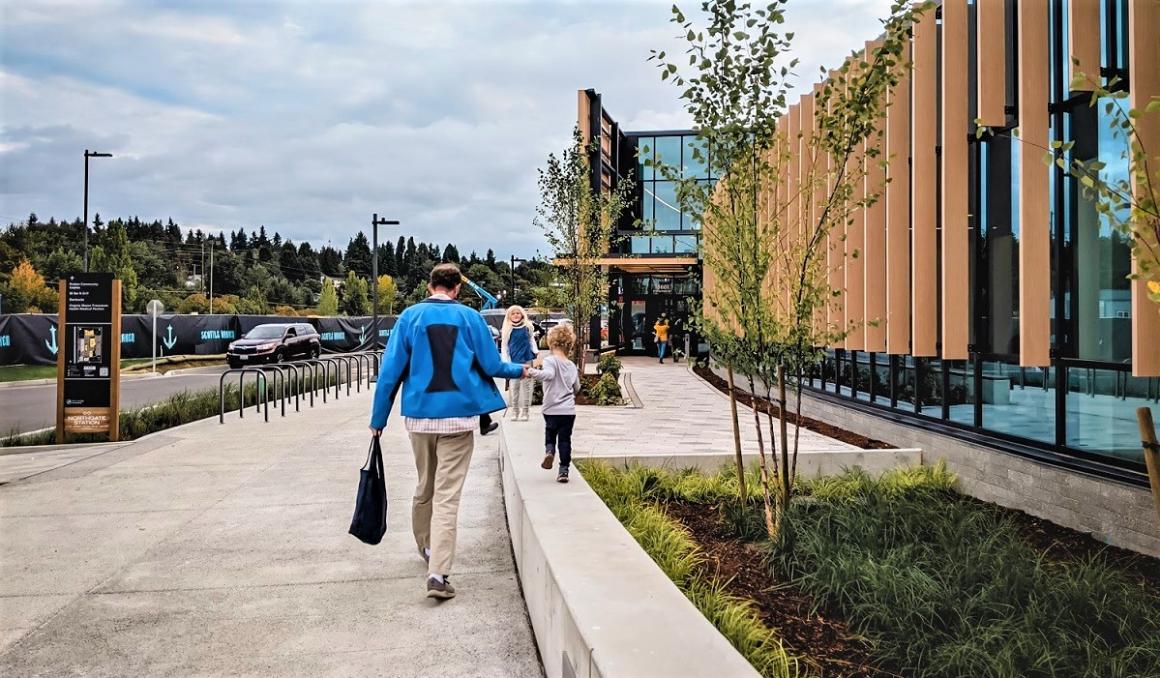 Family entering the new Kraken Community Iceplex in north Seattle for a public skating ice skating session