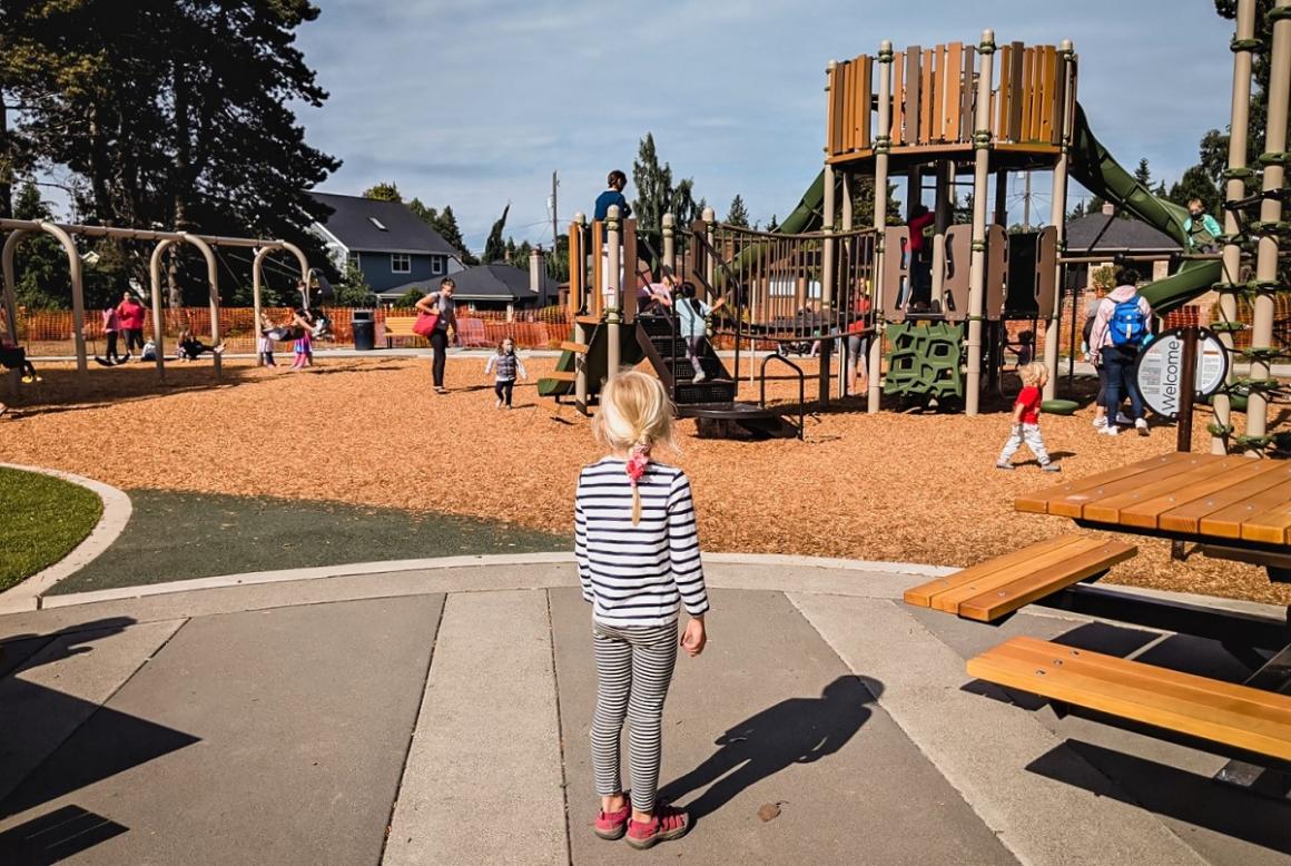 View of children playing at new Loyal Heights Playfield playground opened June 2021