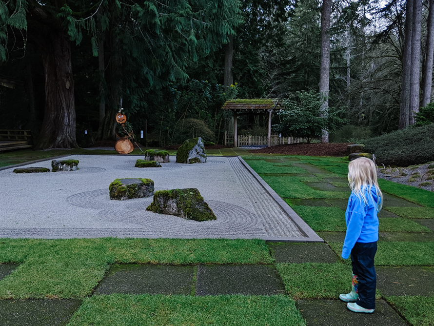 kid standing near a garden at Bloedel Reserve