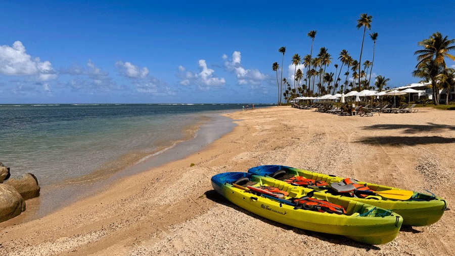 kayaks on the beach ready for a family adventure in Puerto Rico