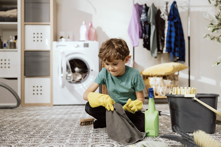 Boy cleaning the floor gratitude activities for kids