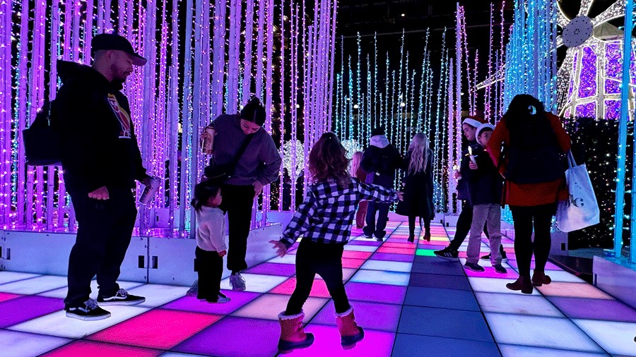 families on the light up dance floor at Enchant Christmas