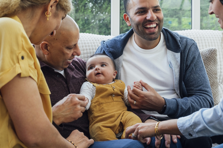 Family talking to a baby 