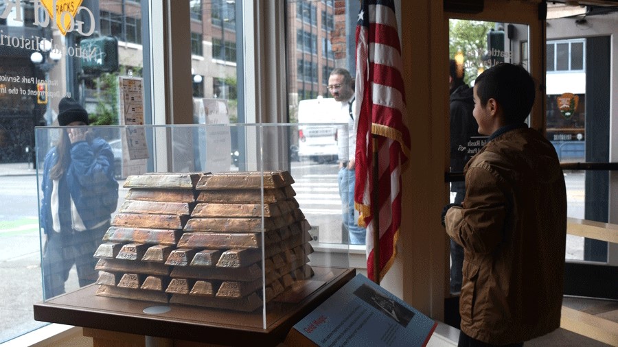 young child at Klondike Gold Rush National History Park in Pioneer Square, a free Seattle museum