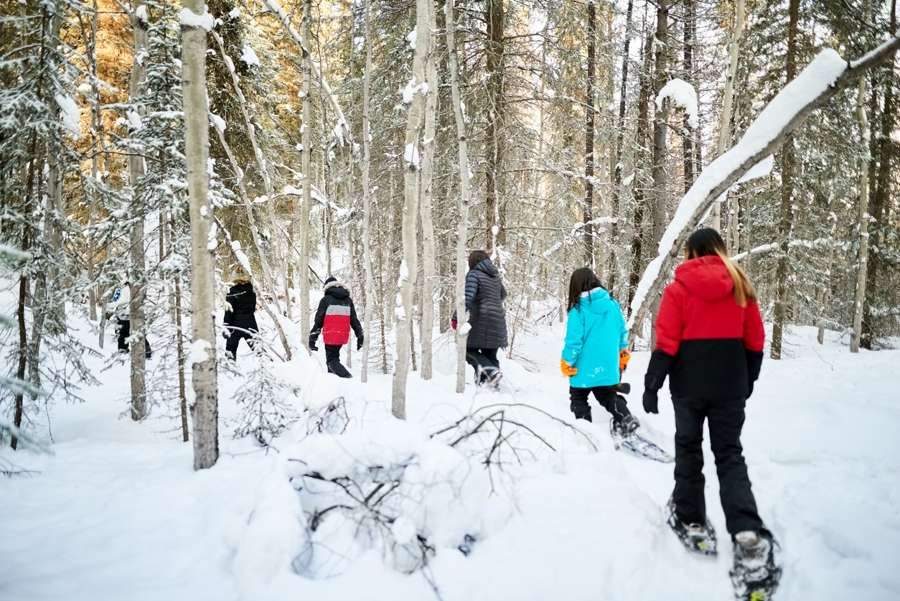 Group on a snowshoeing winter family adventure