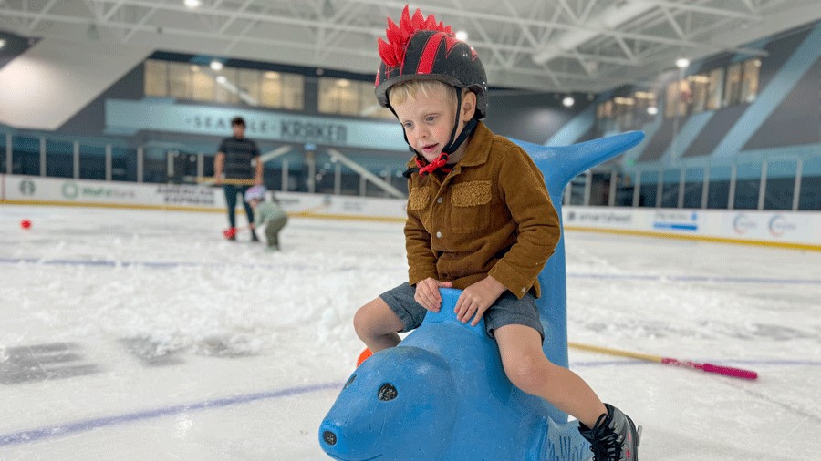 young boy on a skate-aid seal at Kraken Community Iceplex, and indoory activity place for Seattle families