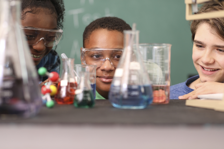 Kids in a classroom working on science experiment