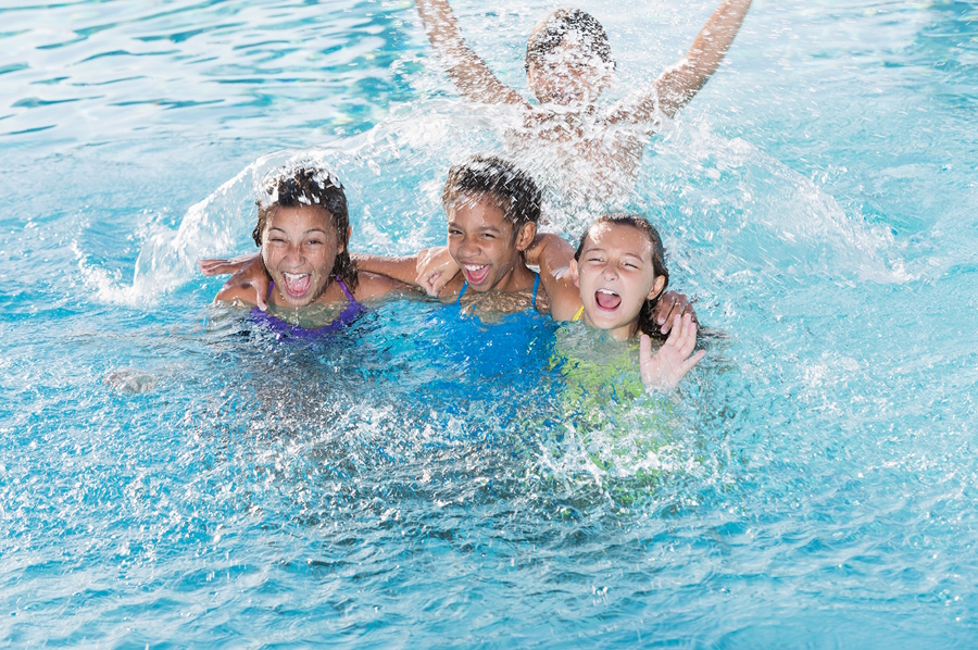 kids in a swimming pool at summer camp