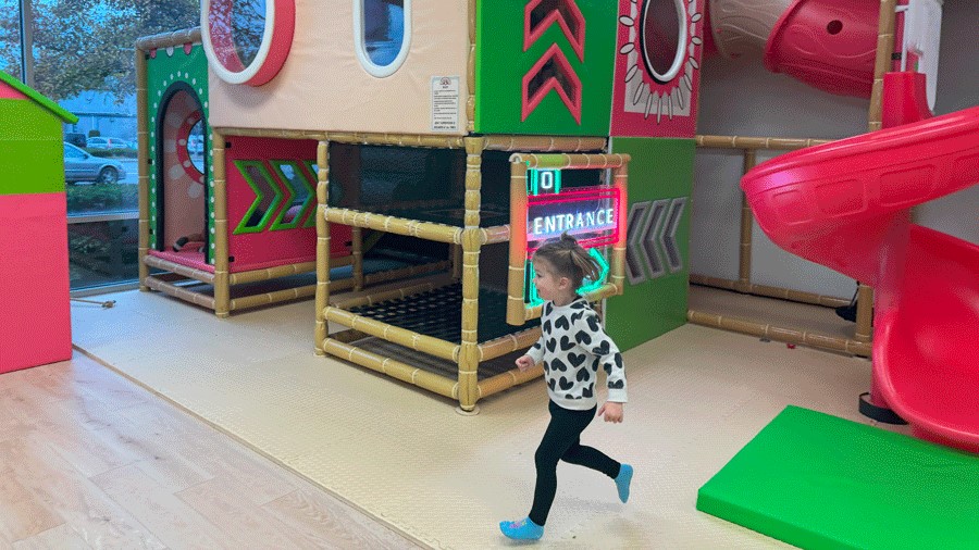 young girl running at Little Pandas Play Cafe in Everett, a new indoor playground