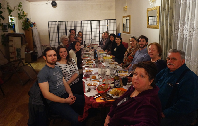 Diners at a Migrating Meals dinner. Copyright Project Feast