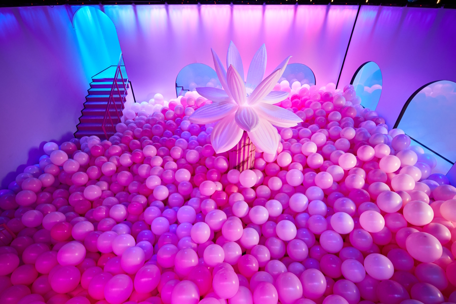 room full of pink bubble and a large pink flower