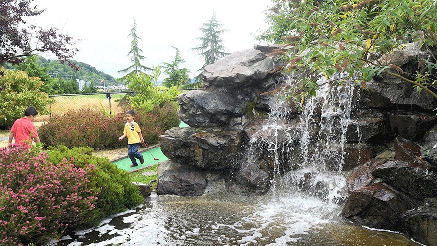 kids playing mini golf at interbay, a fun retro activity for families