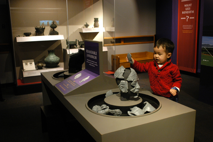 An interactive feature piecing together a warrior’s head at the Pacific Science Center’s “Terracotta Warriors” exhibit. Photo credit: JiaYing Grygiel